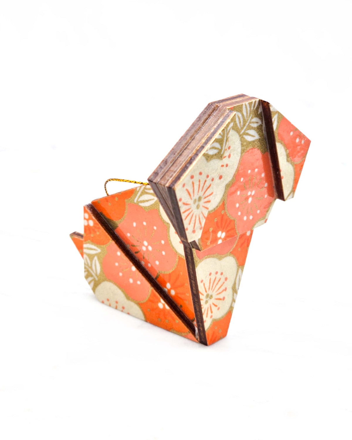 Large wooden origami dog ornament featuring large orange and cream plum blossoms on a metallic gold background.