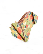 Large wooden origami dog ornament featuring orange, blue, and white plum blossoms on a green background with metallic gold details.
