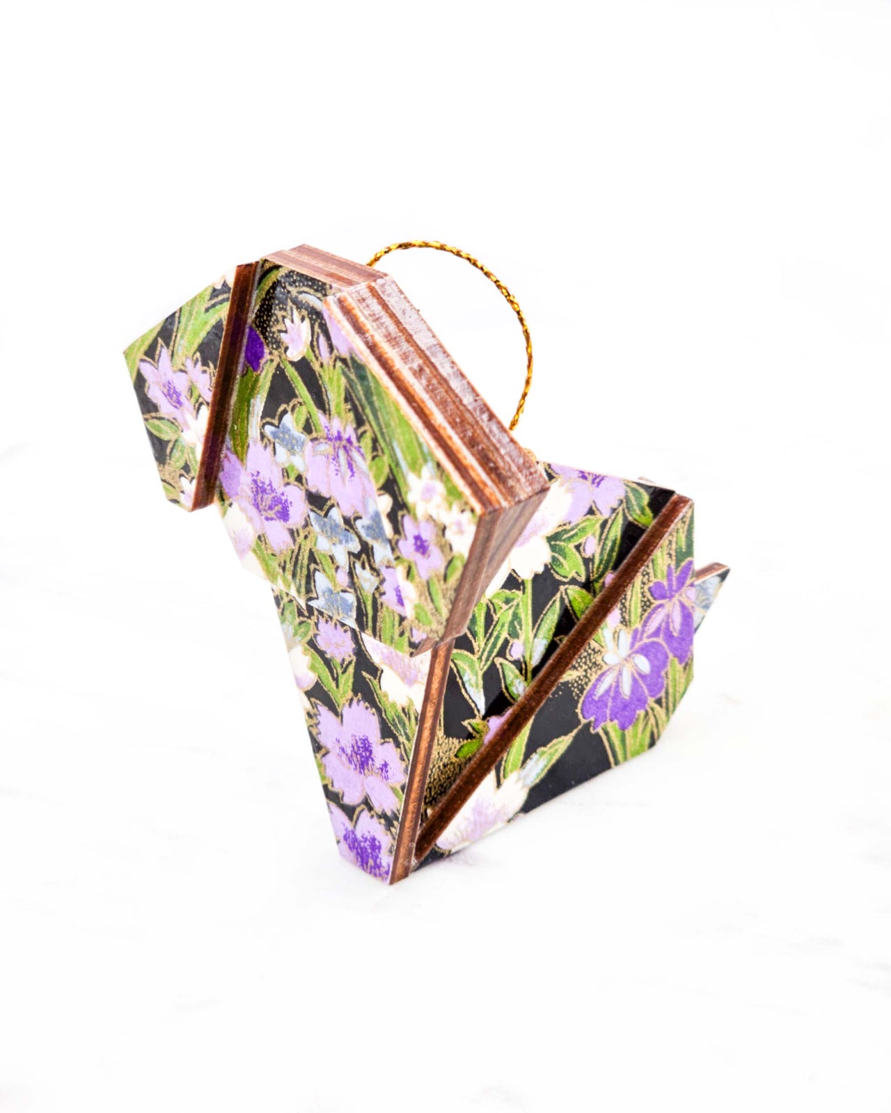 Large wooden origami dog ornament featuring blue, purple, and white irises with green stems on a black background with metallic gold details.