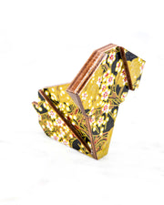 Large wooden origami dog ornament featuring small white plum blossom branches with gold and red water ripples and large gold clouds on a black background with metallic gold details.