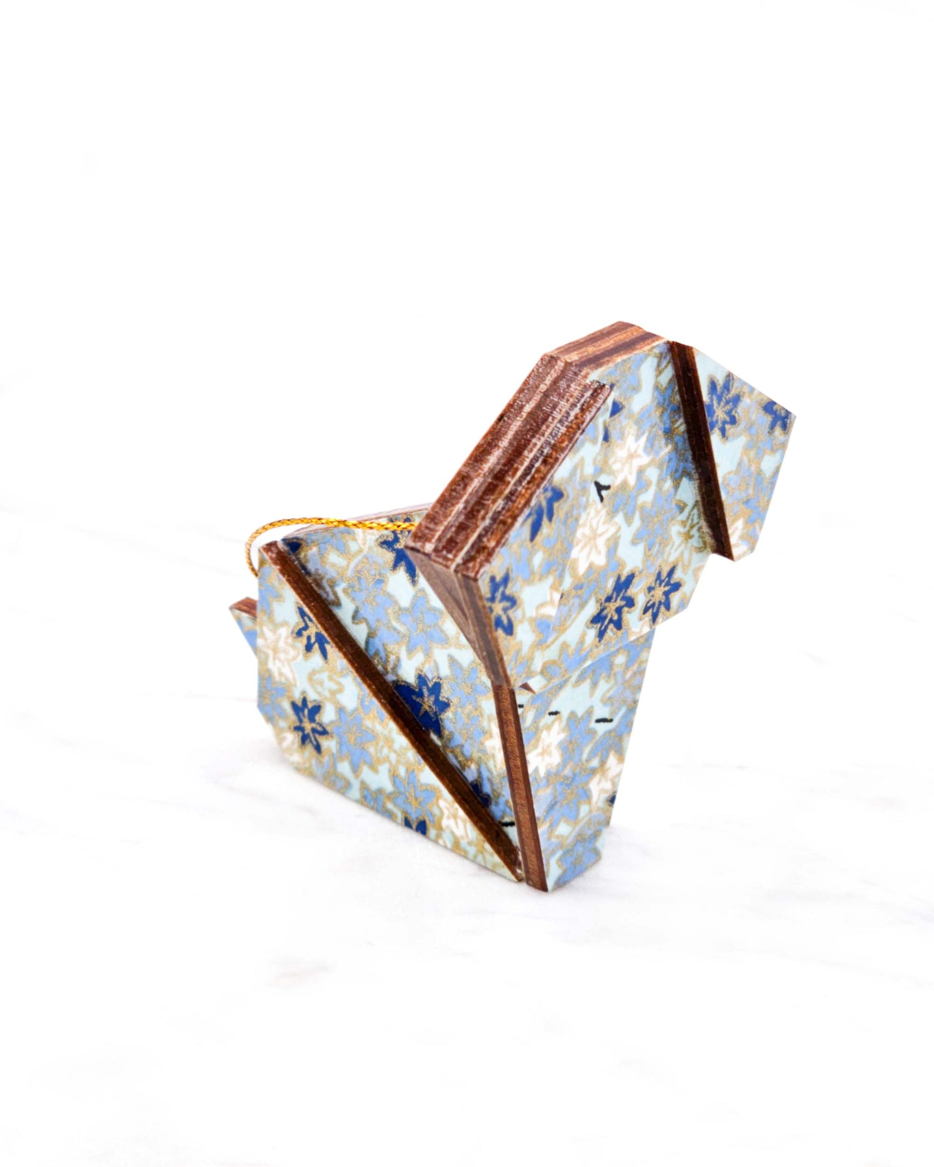 Small wooden origami dog ornament featuring small blue and white momiji (maple leaves) on a light blue background with metallic gold details.