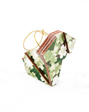 Small wooden origami dog ornament featuring green and white cherry and plum blossoms on a green background with metallic gold details.