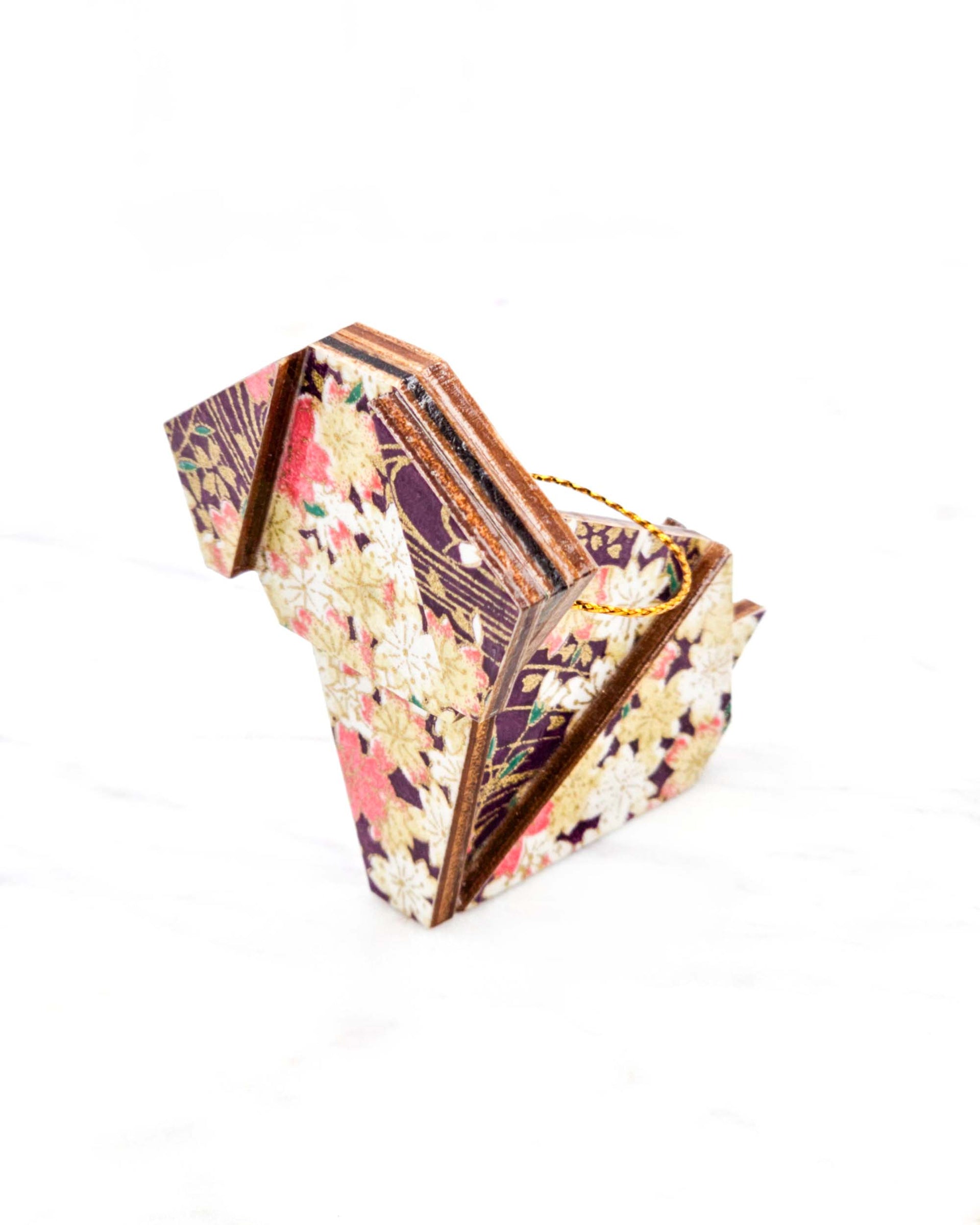 Small wooden origami dog ornament featuring pink and cream cherry blossoms on a dark purple background with metallic gold details.