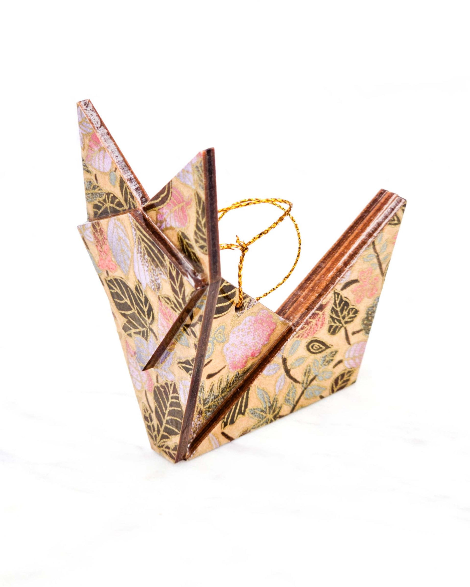 Large wooden origami fox ornament featuring a variety of brown, pink, and purple leaves on a light brown background with metallic gold details.