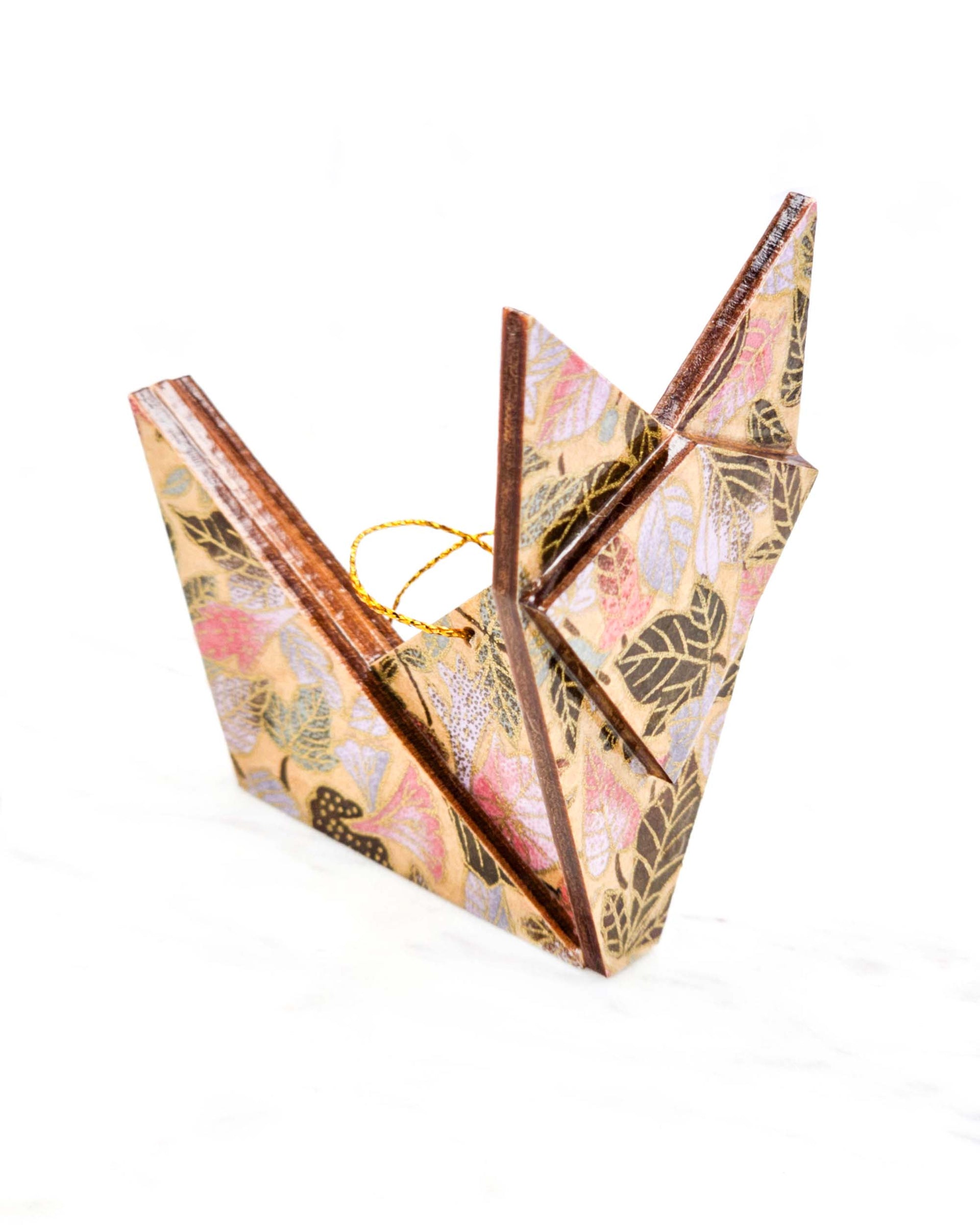 Large wooden origami fox ornament featuring a variety of brown, pink, and purple leaves on a light brown background with metallic gold details.