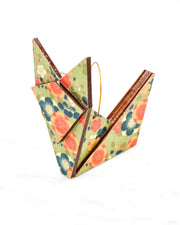 Large wooden origami fox ornament featuring orange, blue, and white plum blossoms on a green background with metallic gold details.