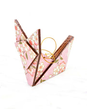 Large wooden origami fox ornament featuring pink and white cherry blossoms with green leaves on a light pink background with metallic gold details.