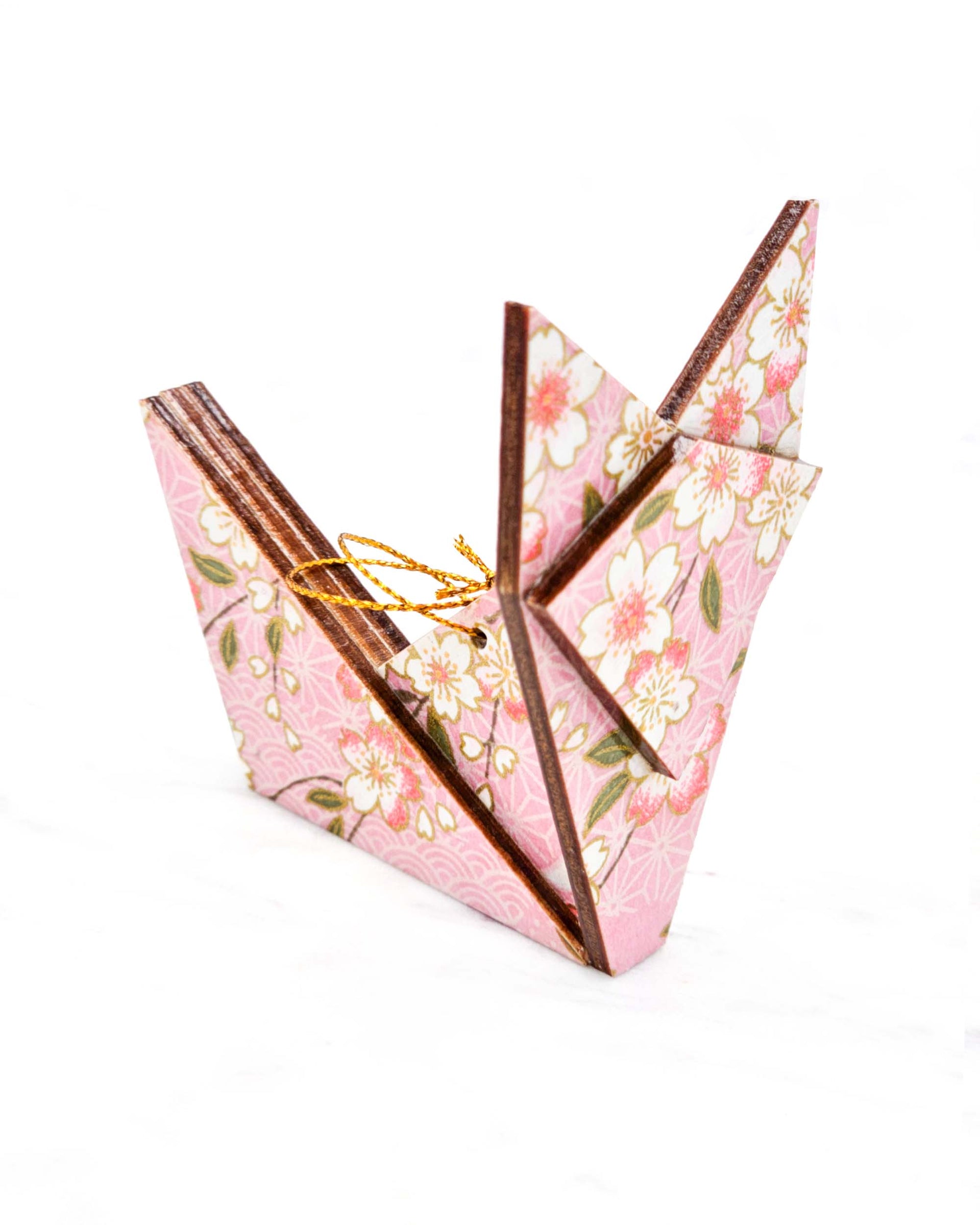 Large wooden origami fox ornament featuring pink and white cherry blossoms with green leaves on a light pink background with metallic gold details.