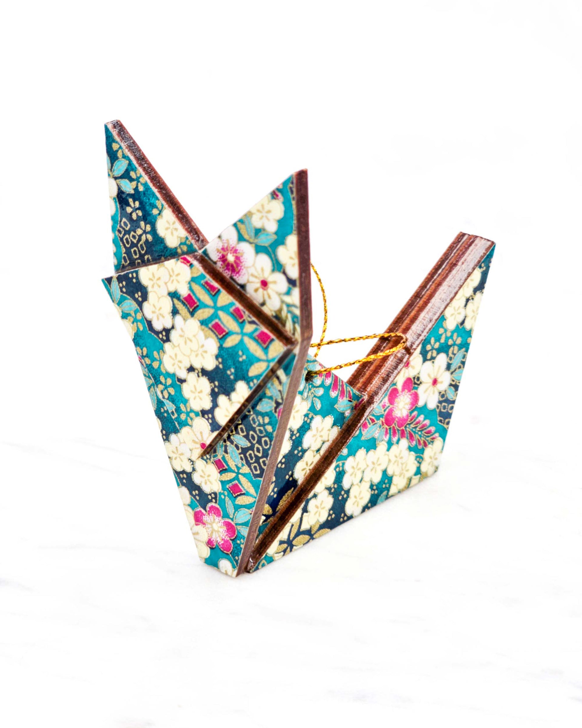 Large wooden origami fox ornament featuring cream and magenta pink plum blossoms and wisterias on a teal blue background with metallic gold details.