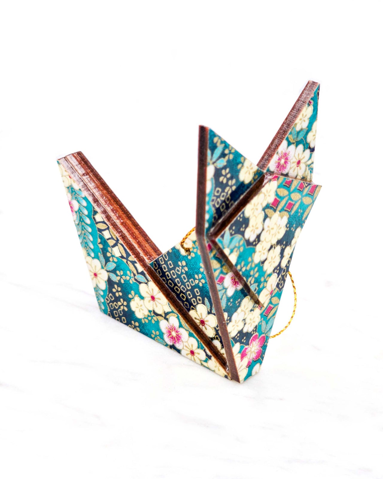 Large wooden origami fox ornament featuring cream and magenta pink plum blossoms and wisterias on a teal blue background with metallic gold details.
