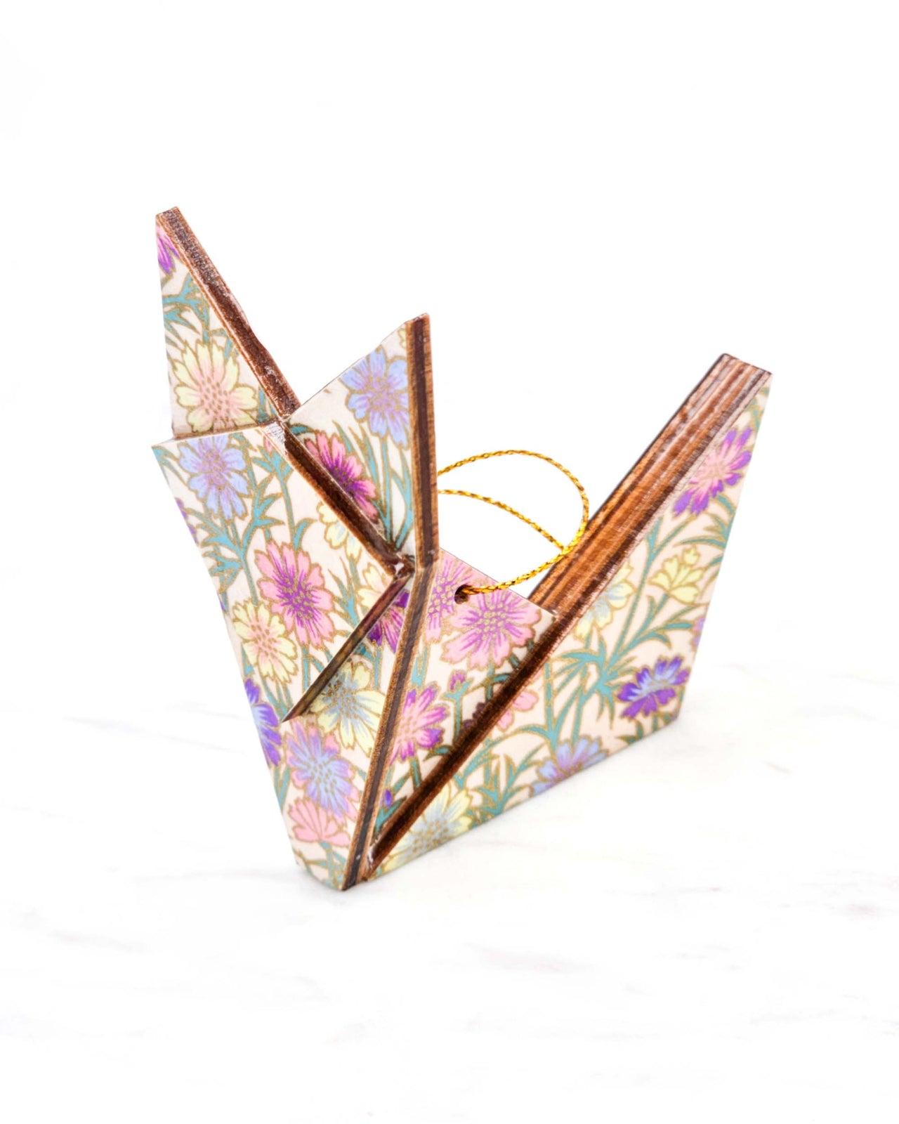 Large wooden origami fox ornament featuring purple and yellow flowers with green stems on a light pink background with metallic gold details.