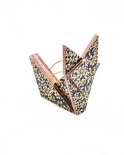 Small wooden origami fox ornament featuring a metallic gold floral motif on a black background.