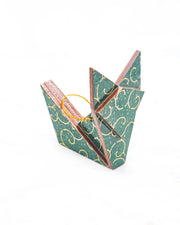 Small wooden origami fox ornament featuring a metallic gold traditional karakusa design on a green background with silver glitter accents.