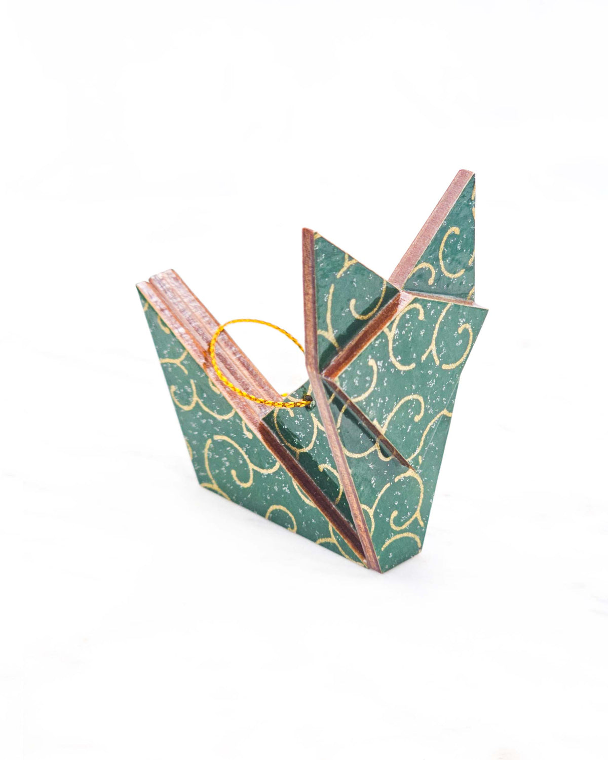 Small wooden origami fox ornament featuring a metallic gold traditional karakusa design on a green background with silver glitter accents.