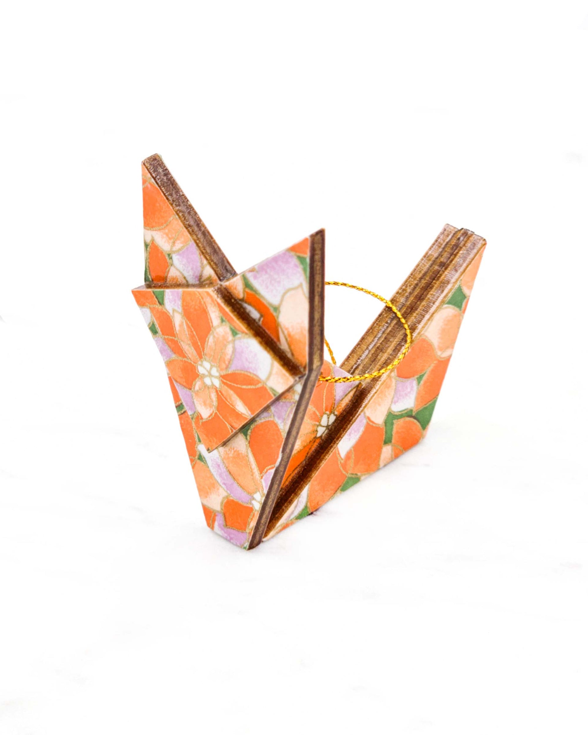 Small wooden origami fox ornament featuring orange and purple lotuses on a green background with metallic gold details.