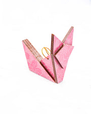 Small wooden origami fox ornament featuring white pointillistic cherry blossoms on a pink background.