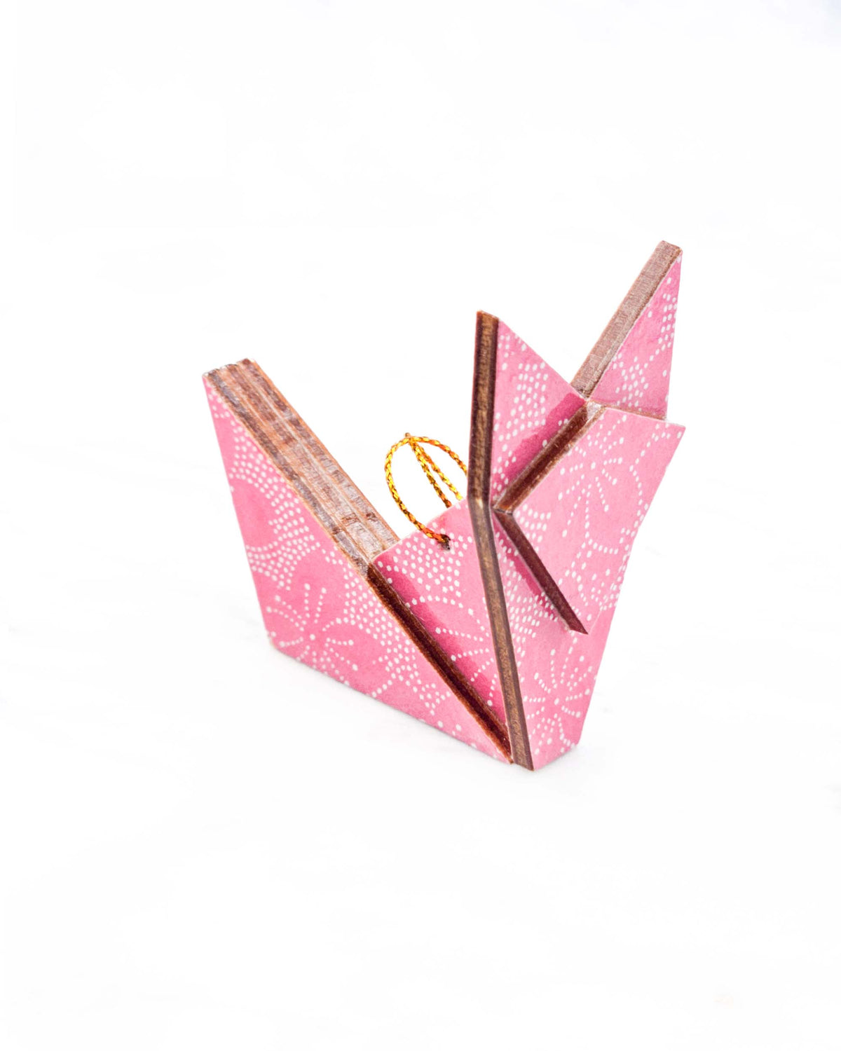 Small wooden origami fox ornament featuring white pointillistic cherry blossoms on a pink background.