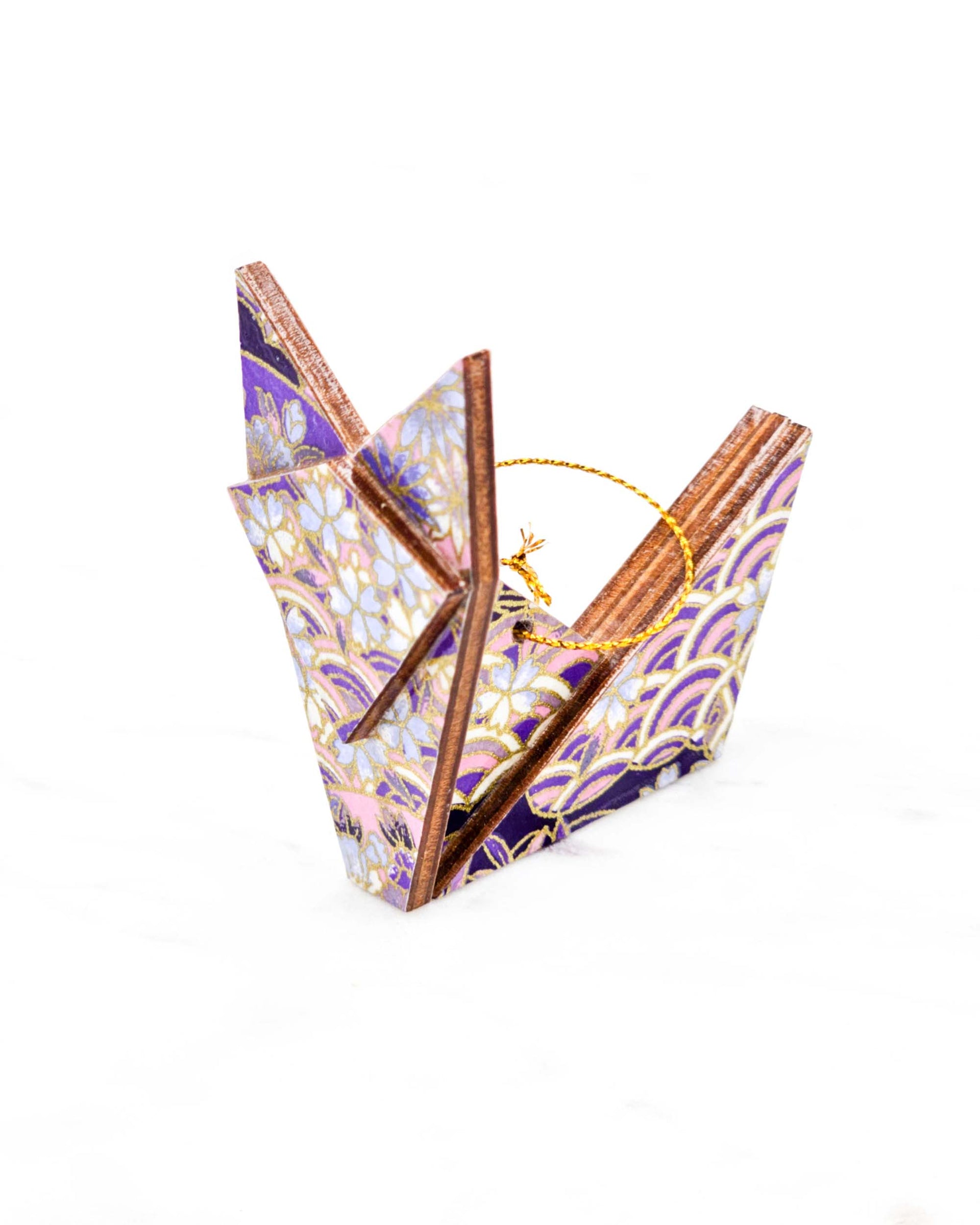 Small wooden origami fox ornament featuring small purple cherry blossoms and purple and white shippo and seigaiha patterns with metallic gold details.
