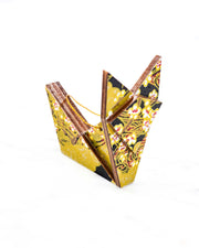Small wooden origami fox ornament featuring small white plum blossom branches with gold and red water ripples and large gold clouds on a black background with metallic gold details.