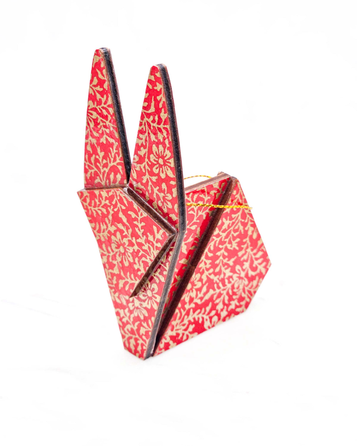 Large wooden origami rabbit ornament featuring a metallic gold floral motif on a bright red background.