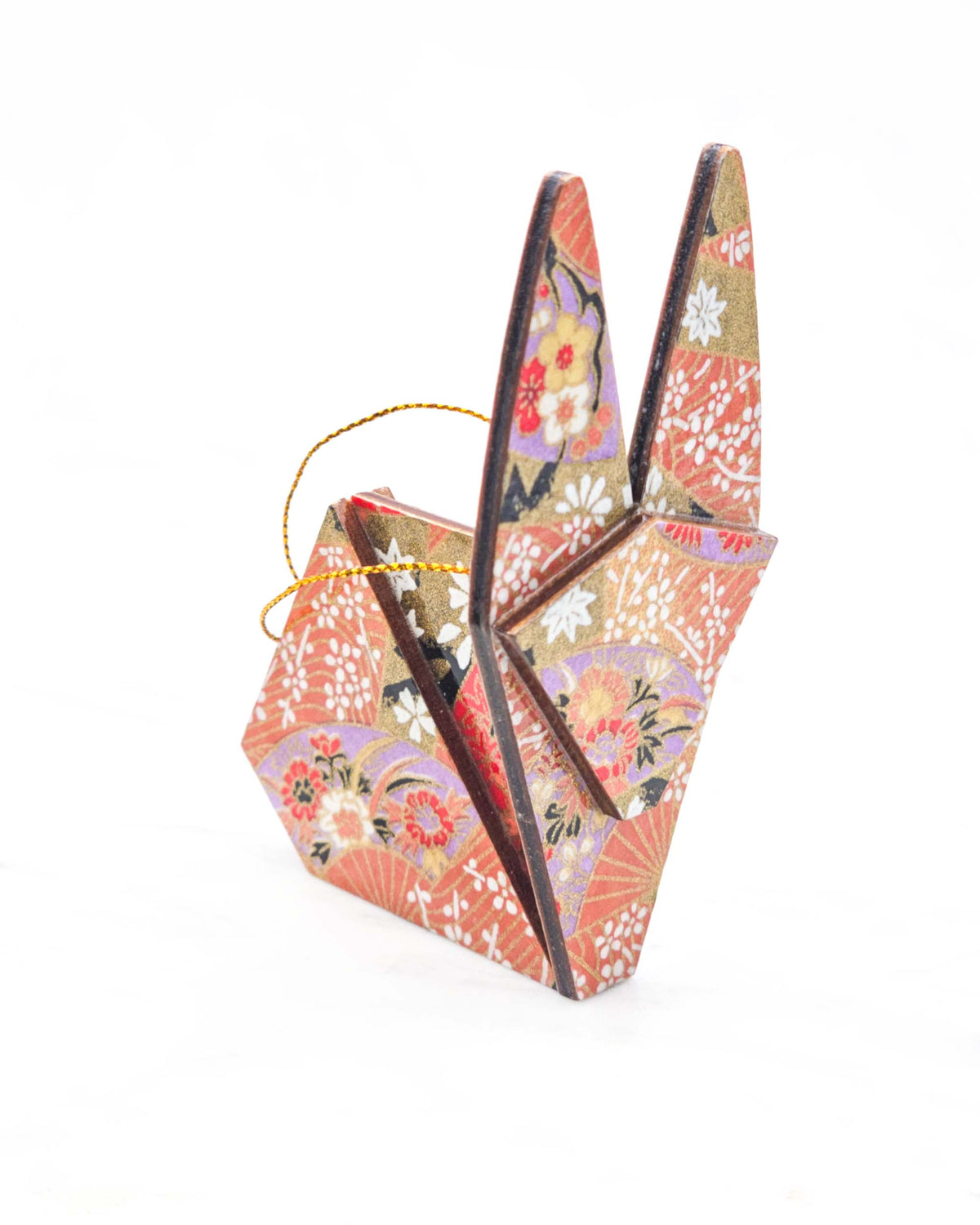 Large wooden origami rabbit ornament featuring red and purple floral hand fans and gold floral ribbons on an orange gradient background covered in small white plum blossoms with metallic gold details.