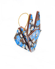 Small wooden origami rabbit ornament featuring blue plum blossoms with brown branches on a black background with metallic gold details.