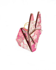 Small wooden origami rabbit ornament featuring pink and white cherry blossoms on a pearlescent pink background with metallic gold details.