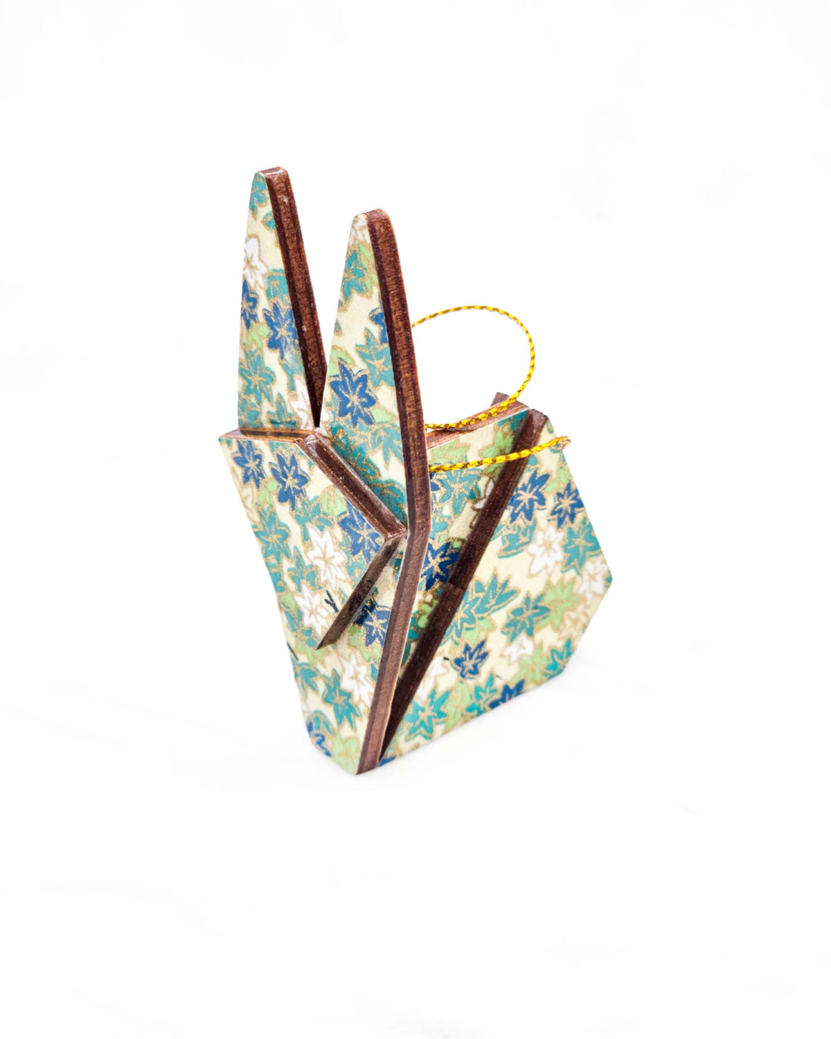 Small wooden origami rabbit ornament featuring small green and white momiji (maple leaves) on a light green background with metallic gold details.