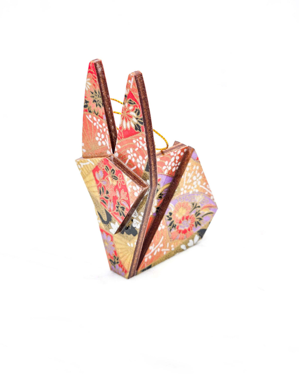 Small wooden origami rabbit ornament featuring red and purple floral hand fans and gold floral ribbons on an orange gradient background covered in small white plum blossoms with metallic gold details.