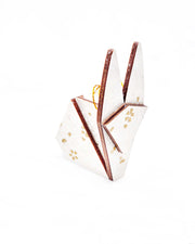 Small wooden origami rabbit ornament featuring gold and white cherry blossoms on a pearlescent white background with small metallic silver specks.