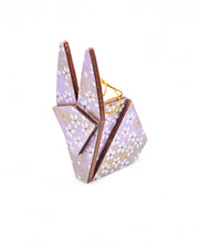 Small wooden origami rabbit ornament featuring small white and gold cherry blossoms on a purple background with metallic gold details.