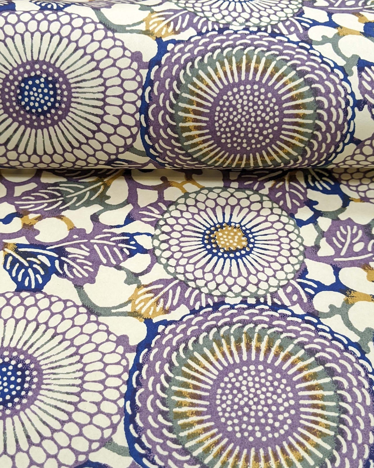 Japanese chiyogami paper featuring large purple & yellow zinnia flowers on a beige background.