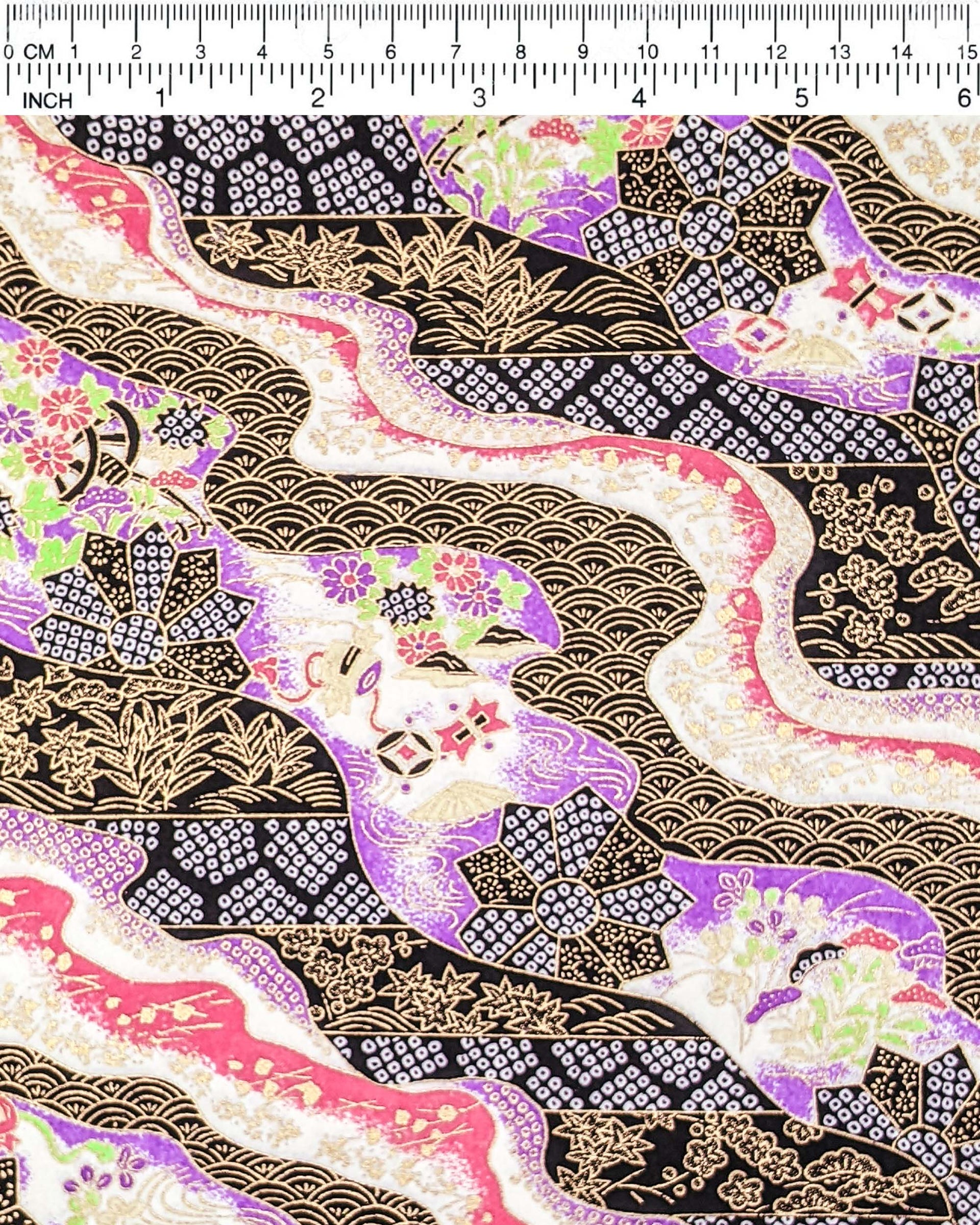 Japanese chiyogami paper featuring an assortment of purple, pink, and green flowers, flower cart motifs (hanaguruma), and traditional Japanese geometric designs with metallic gold details. The background is a mix of white, pink, purple, and black.