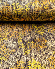 Japanese chiyogami paper featuring metallic gold and copper bamboo shoots on a black background.