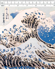 Japanese chiyogami paper featuring a bright blue version of the famous painting "The Great Wave Off Kanagawa" by Katsushika Hokusai with metallic gold details. 