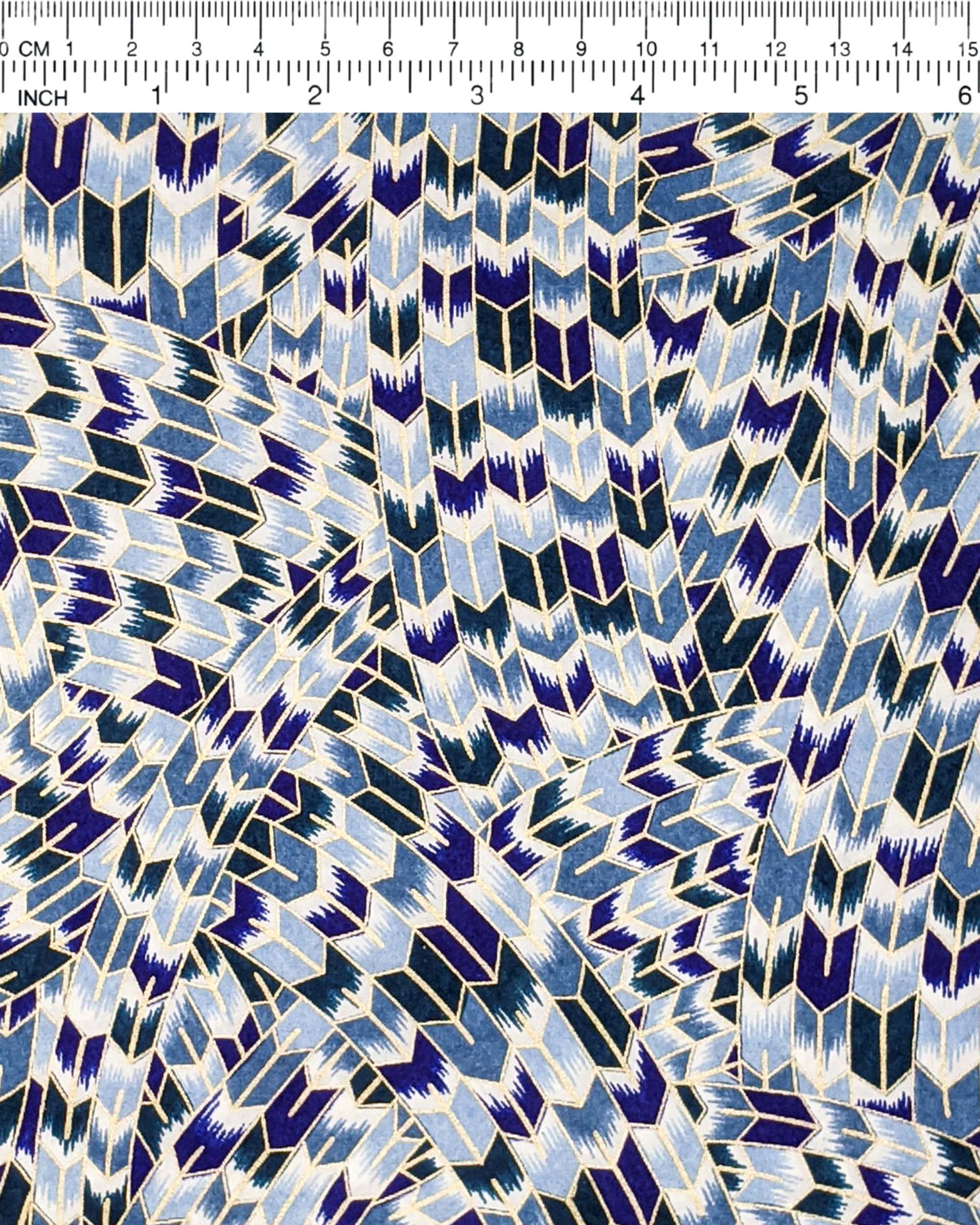 Japanese chiyogami paper featuring blue and white interlocking yagasuri (arrow) swirls with metallic gold details.