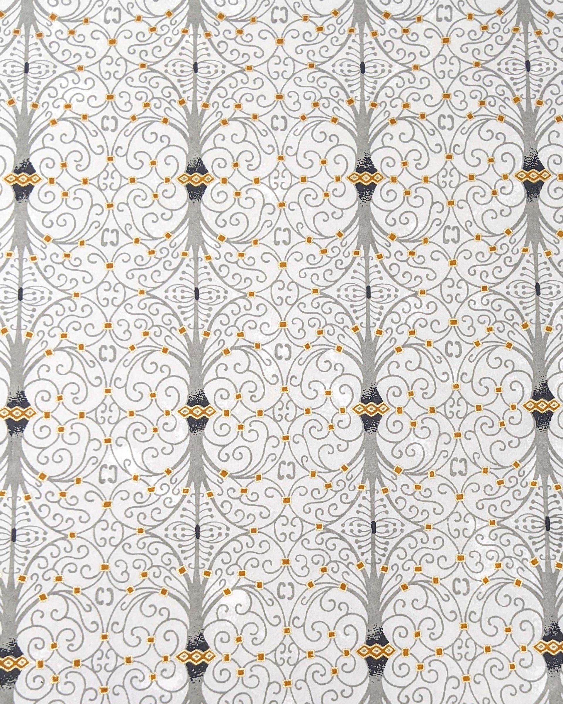 Japanese chiyogami paper featuring a gray wrought iron design on a light gray background with metallic gold details.