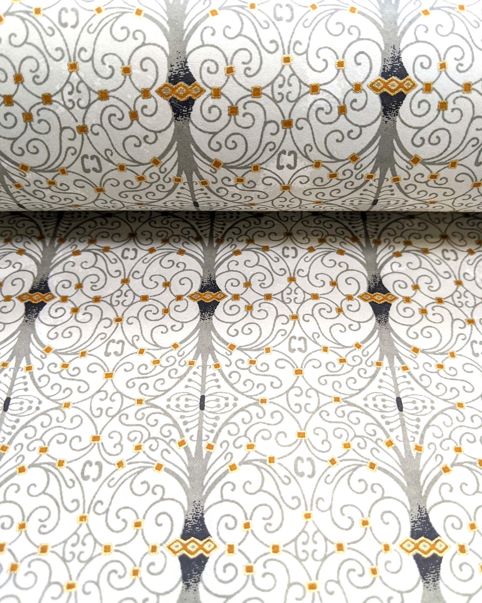 Japanese chiyogami paper featuring a gray wrought iron design on a light gray background with metallic gold details.