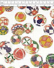 Japanese chiyogami paper featuring an assortment of colorful Japanese temari balls on a white background with metallic gold details.