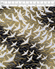 Japanese chiyogami paper featuring white flying cranes in a zigzag formation on a black and gold background with metallic gold and silver details.