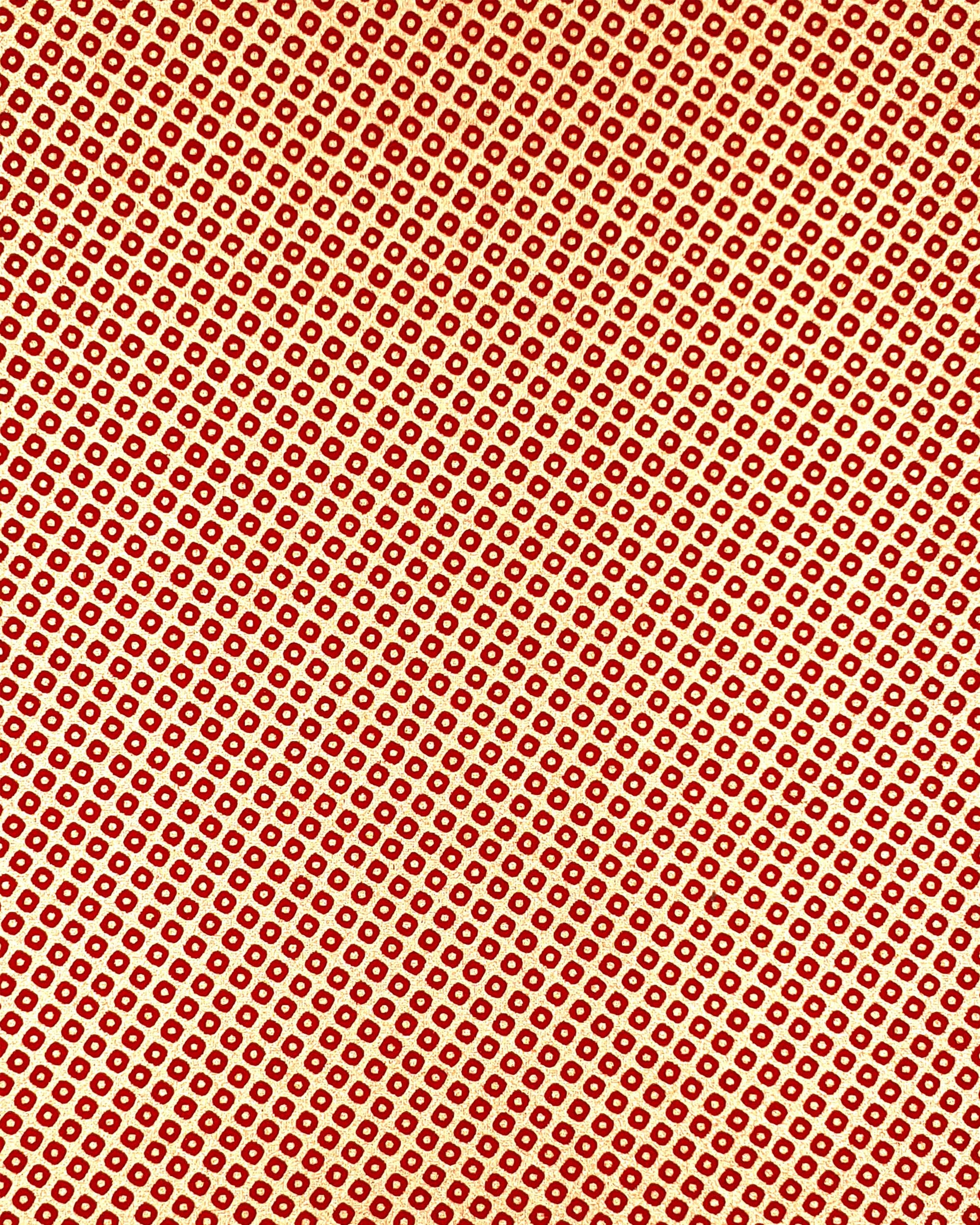Japanese chiyogami paper featuring a traditional metallic gold and red kanoko design. 