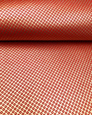 Japanese chiyogami paper featuring a traditional metallic gold and red kanoko design. 