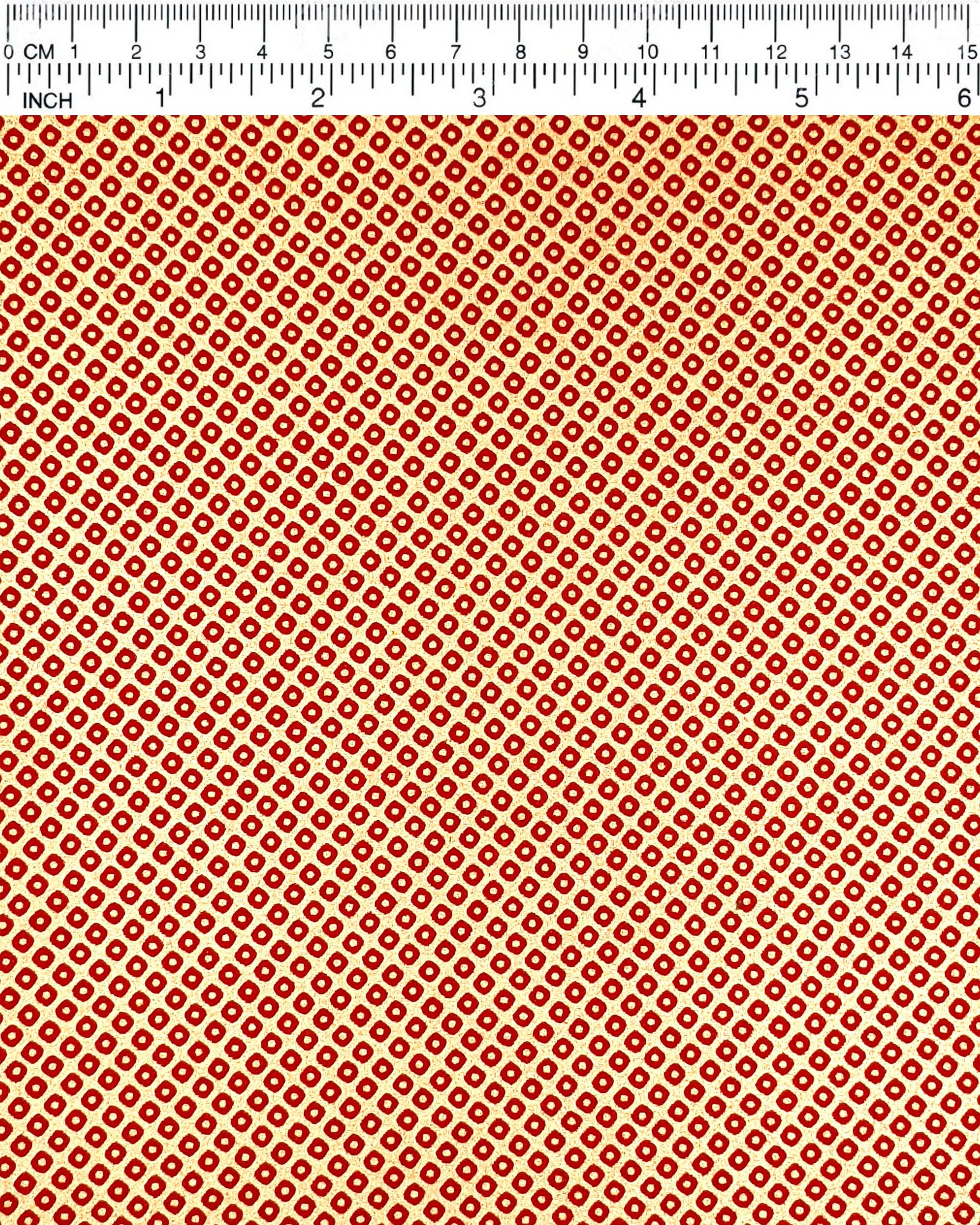 Japanese chiyogami paper featuring a traditional metallic gold and red kanoko design. 