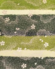 Japanese chiyogami paper featuring gold cherry blossoms on a multi-toned green striped background with metallic gold details.