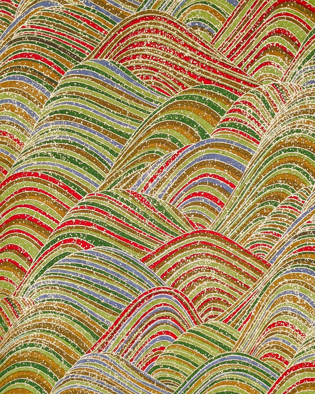 Japanese chiyogami paper featuring striped rolling hills in a mix of green, red, brown,and gray with metallic gold details.