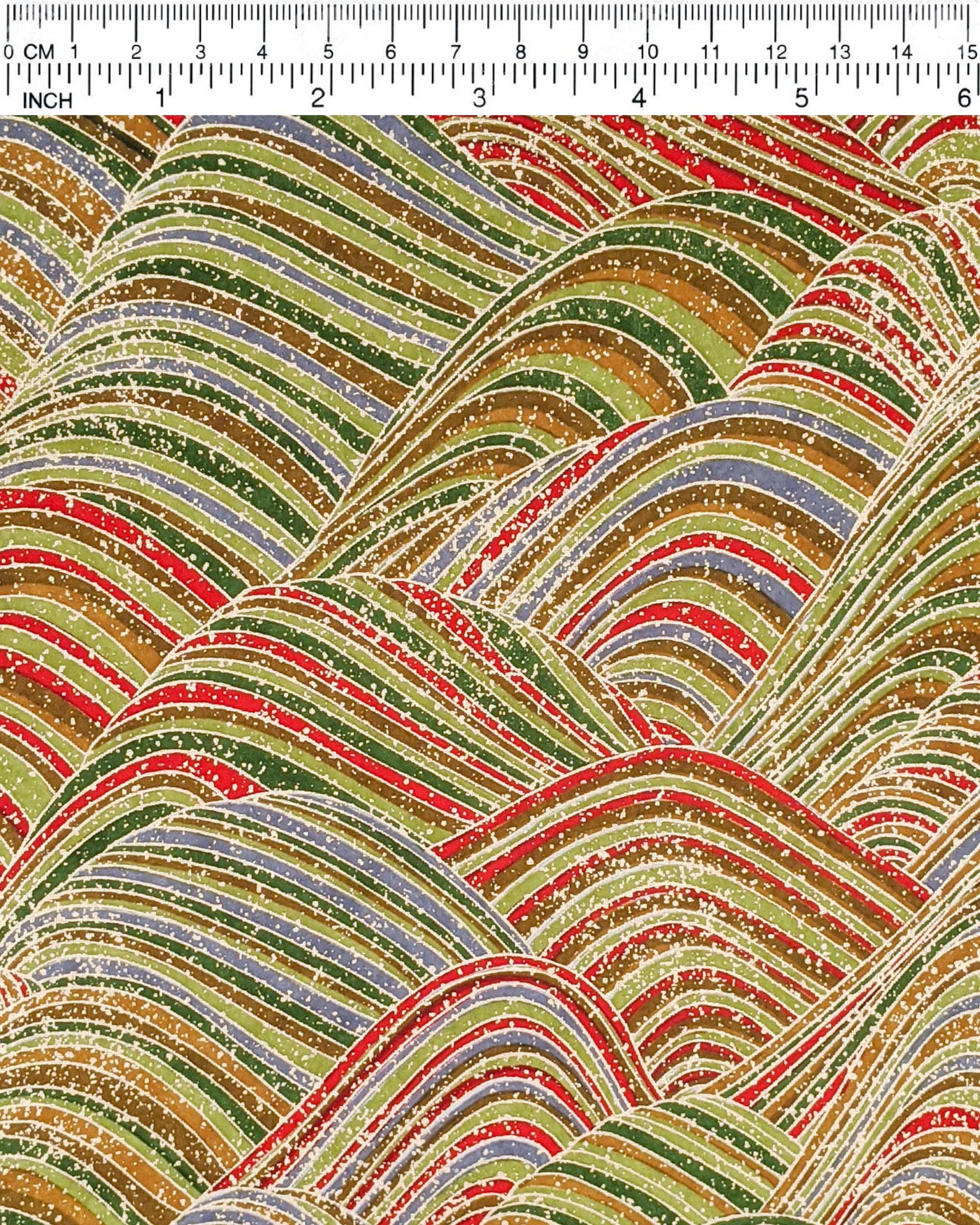 Japanese chiyogami paper featuring striped rolling hills in a mix of green, red, brown,and gray with metallic gold details.