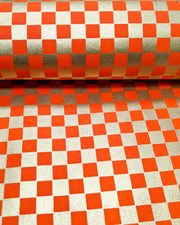 Japanese chiyogami paper featuring a traditional orange and metallic gold ichimatsu (checker) pattern.