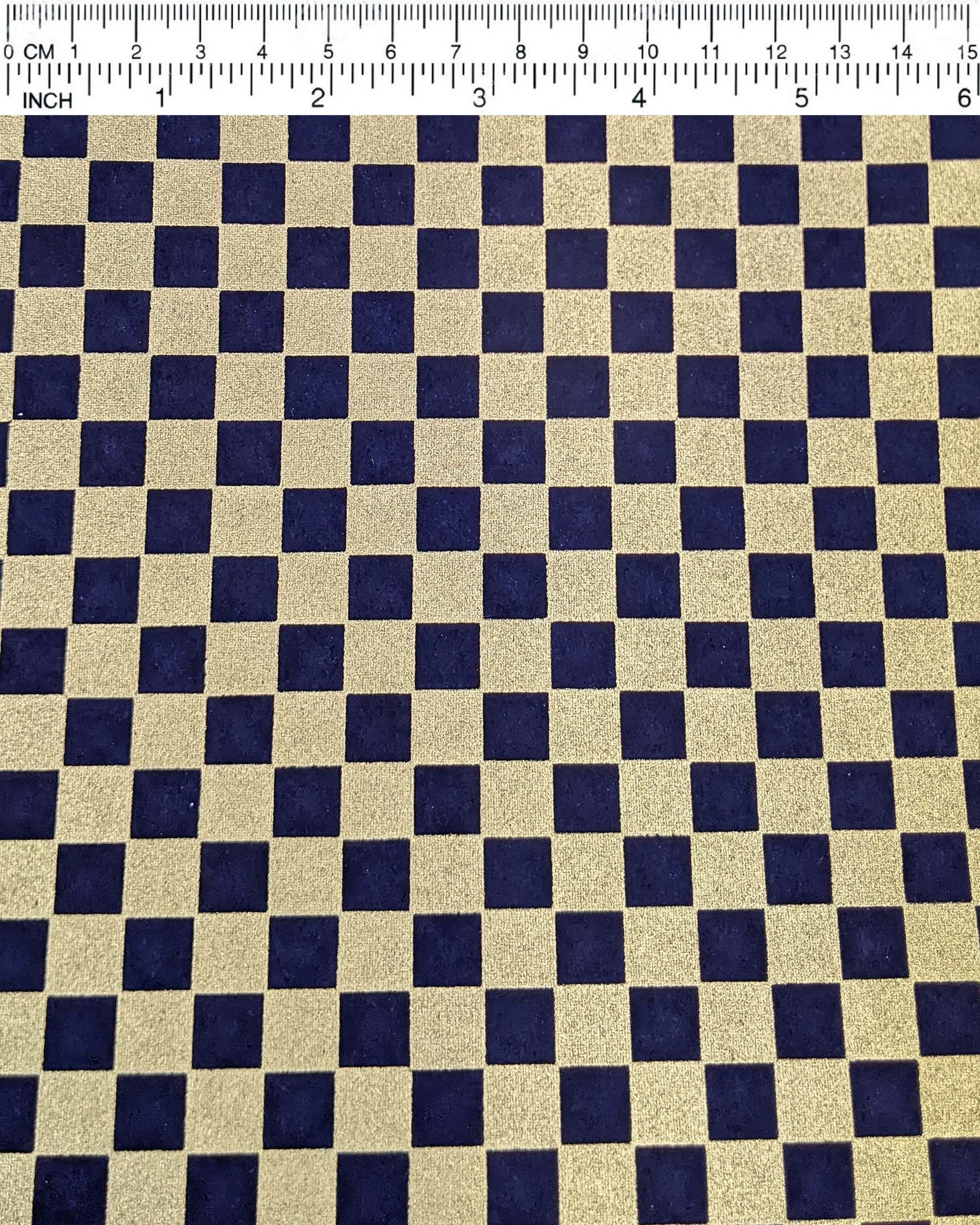 Japanese chiyogami paper featuring a traditional dark blue and metallic gold ichimatsu (checker) pattern.