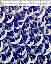 Japanese chiyogami paper featuring blue, gray, and white flying cranes on a blue background with metallic gold details. 