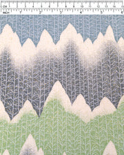 Japanese chiyogami paper featuring white snow-capped mountains with a forest of trees on a gray, blue, and green background with metallic gold glitter details.